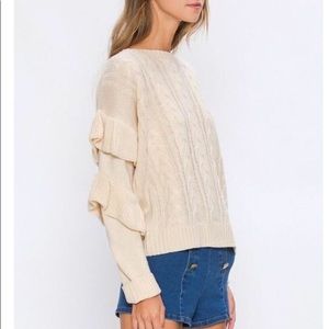 Cable knit sweater with ruffle sleeves